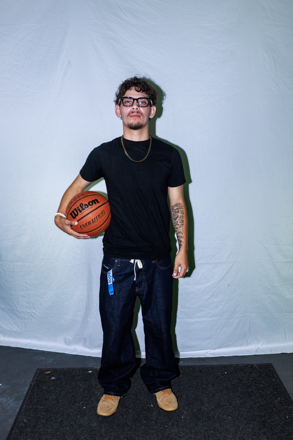 Kaeden Sibrian, founder of Hoop Duels, holding a basketball
